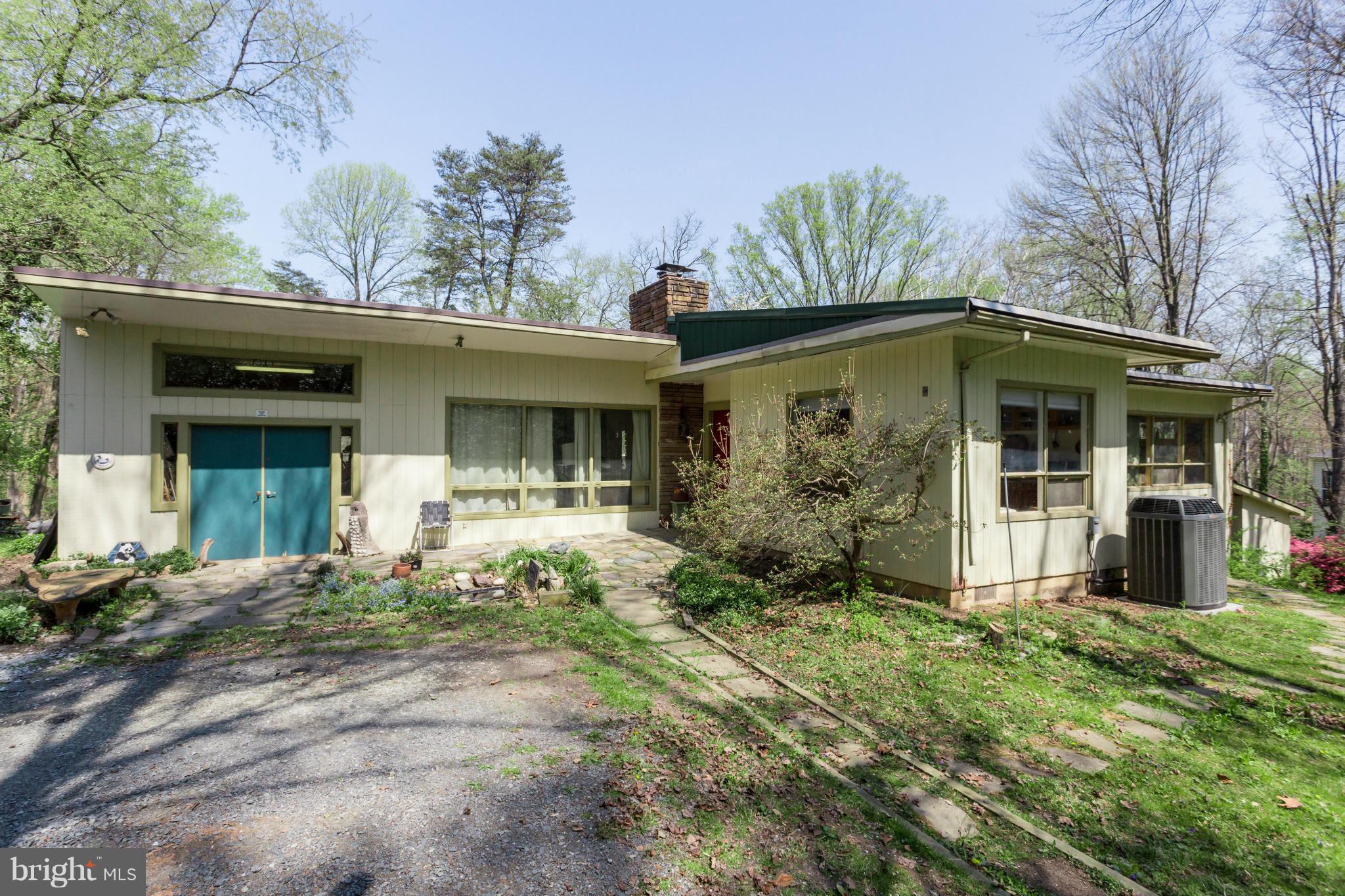 1780 Proffit Road Vienna, VA 22182 - Photo 18 of 21 a front view of a house with garden