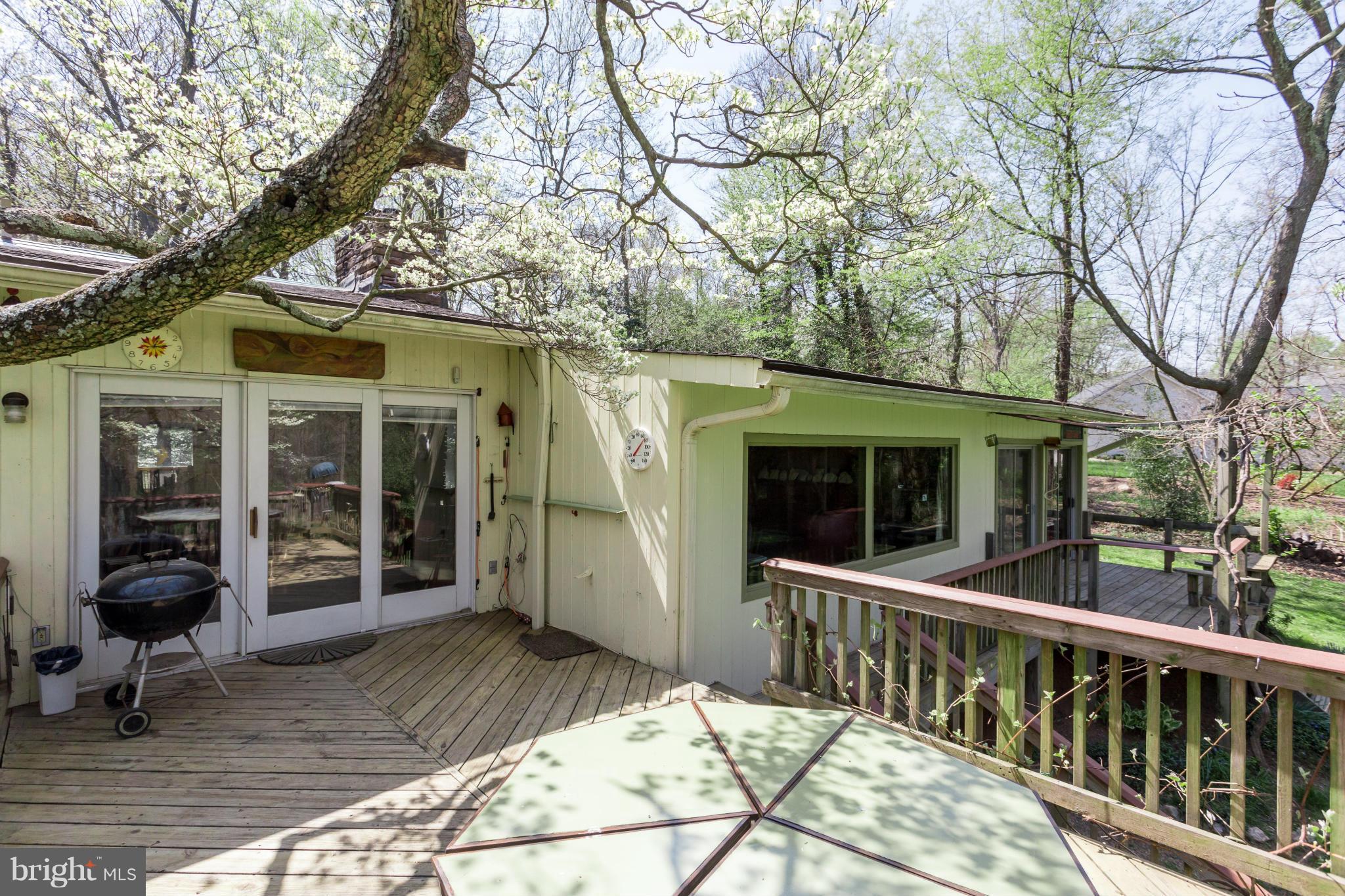 1780 Proffit Road Vienna, VA 22182 - Photo 10 of 21 a view of a house with a large window and a tree