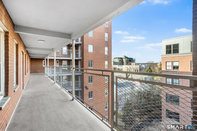 a balcony view with a city view