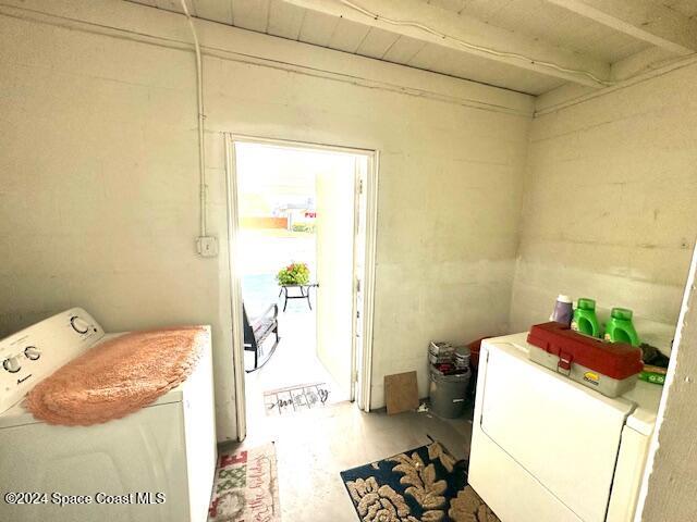 941 Croton Road Melbourne, FL 32935 - Photo 26 of 26 a utility room with dryer and washer