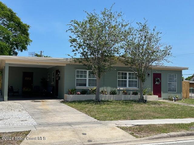 941 Croton Road Melbourne, FL 32935 - Photo 4 of 26 a view of a house with a yard and plants