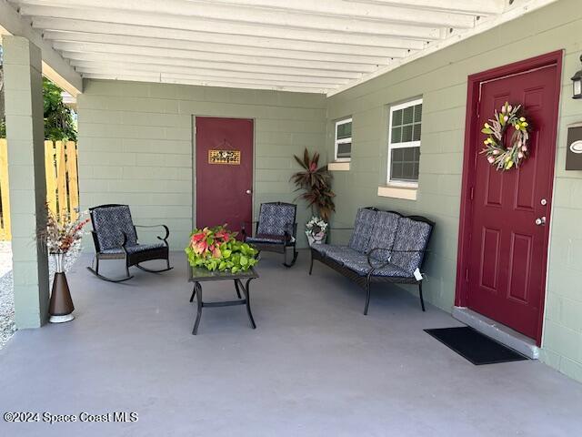 941 Croton Road Melbourne, FL 32935 - Photo 10 of 26 a living room with furniture and a potted plant