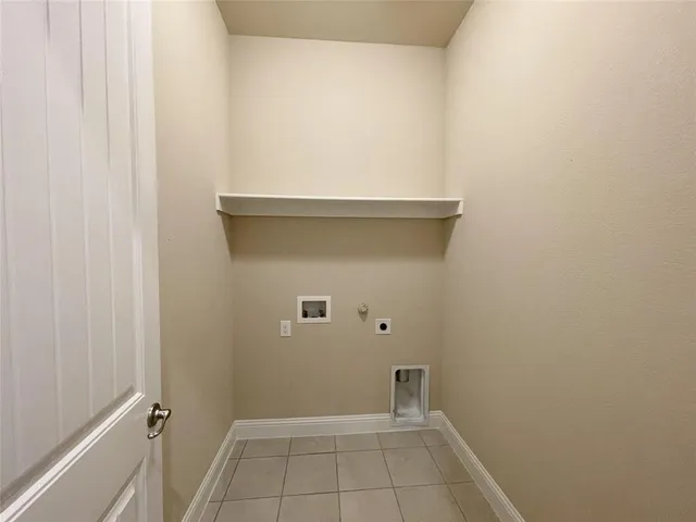 a view of empty room with wooden floor and ceiling fan