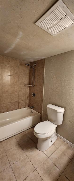5324 Young Drive The Colony, TX 75056 - Photo 4 of 7 a bathroom with a toilet and a bathtub