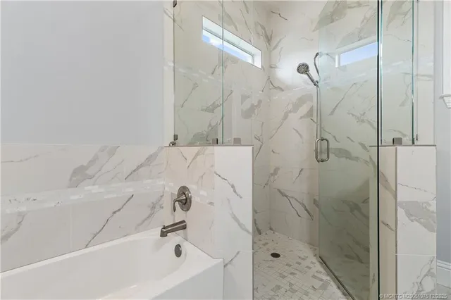 a bathroom with a bathtub and window