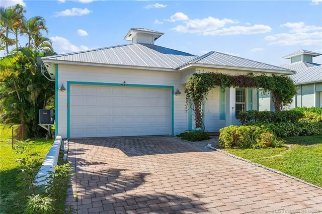 an aerial view of a house with a garden
