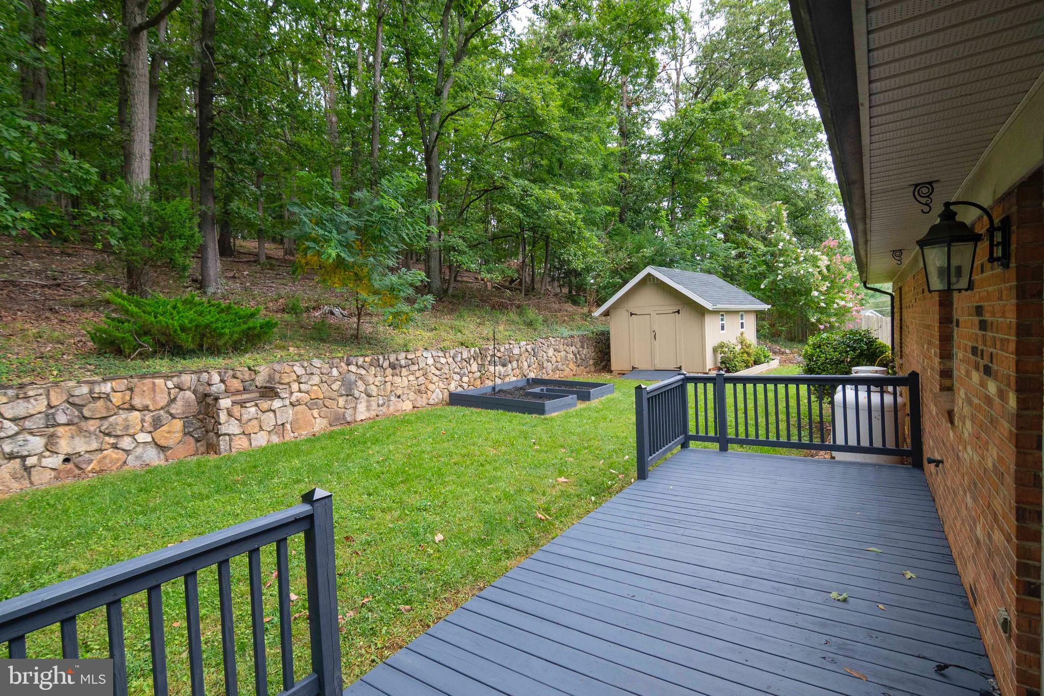 116 Richmond Road Front Royal, VA 22630 - Photo 43 of 60 Backyard with deck, garden and shed.