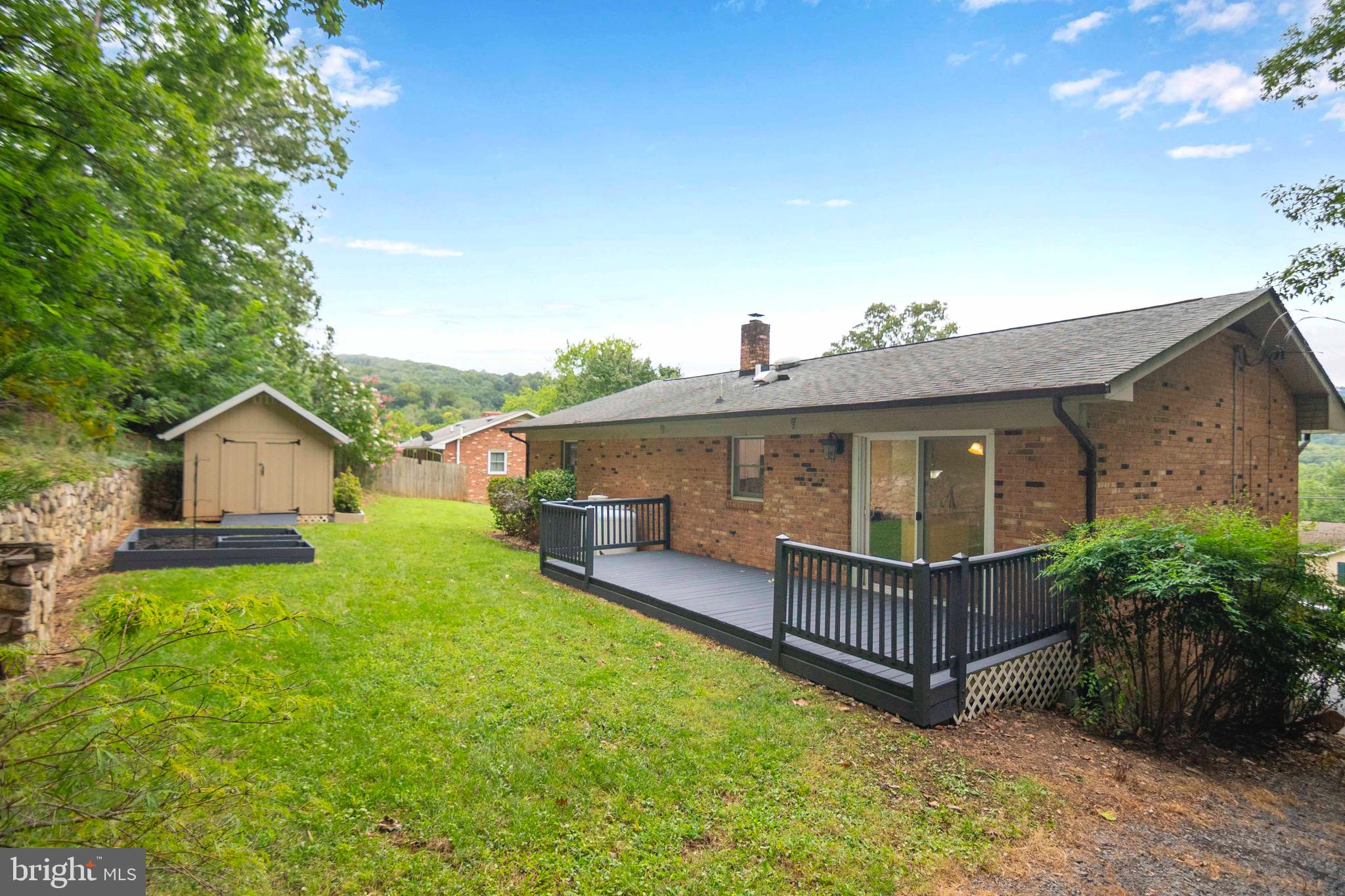116 Richmond Road Front Royal, VA 22630 - Photo 47 of 60 Backyard with deck, garden and shed.