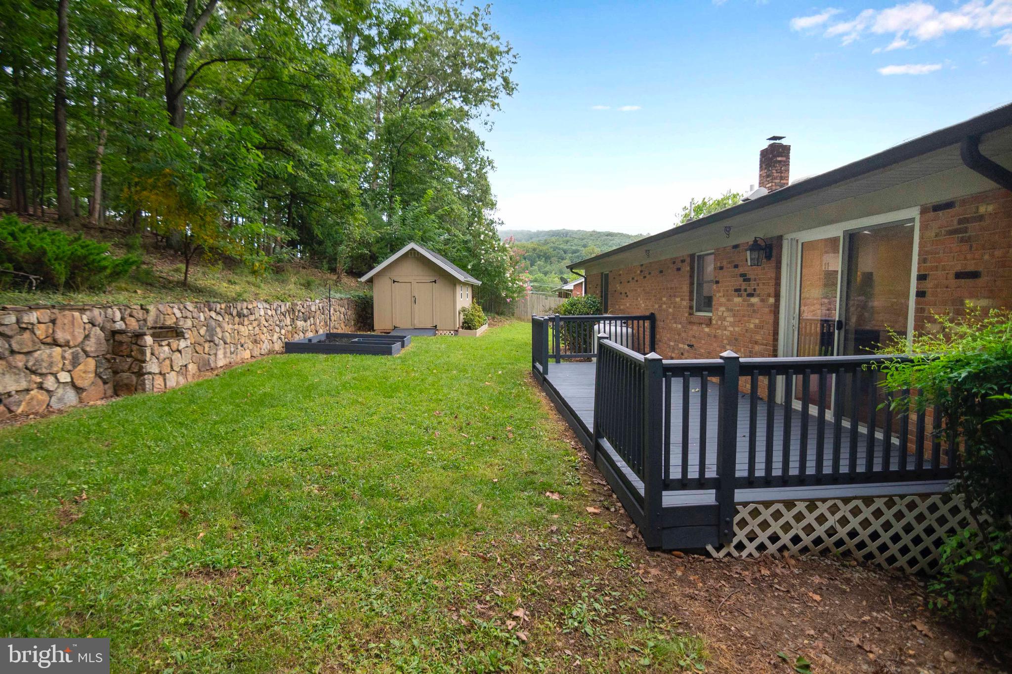 116 Richmond Road Front Royal, VA 22630 - Photo 48 of 60 Backyard with deck, garden and shed.
