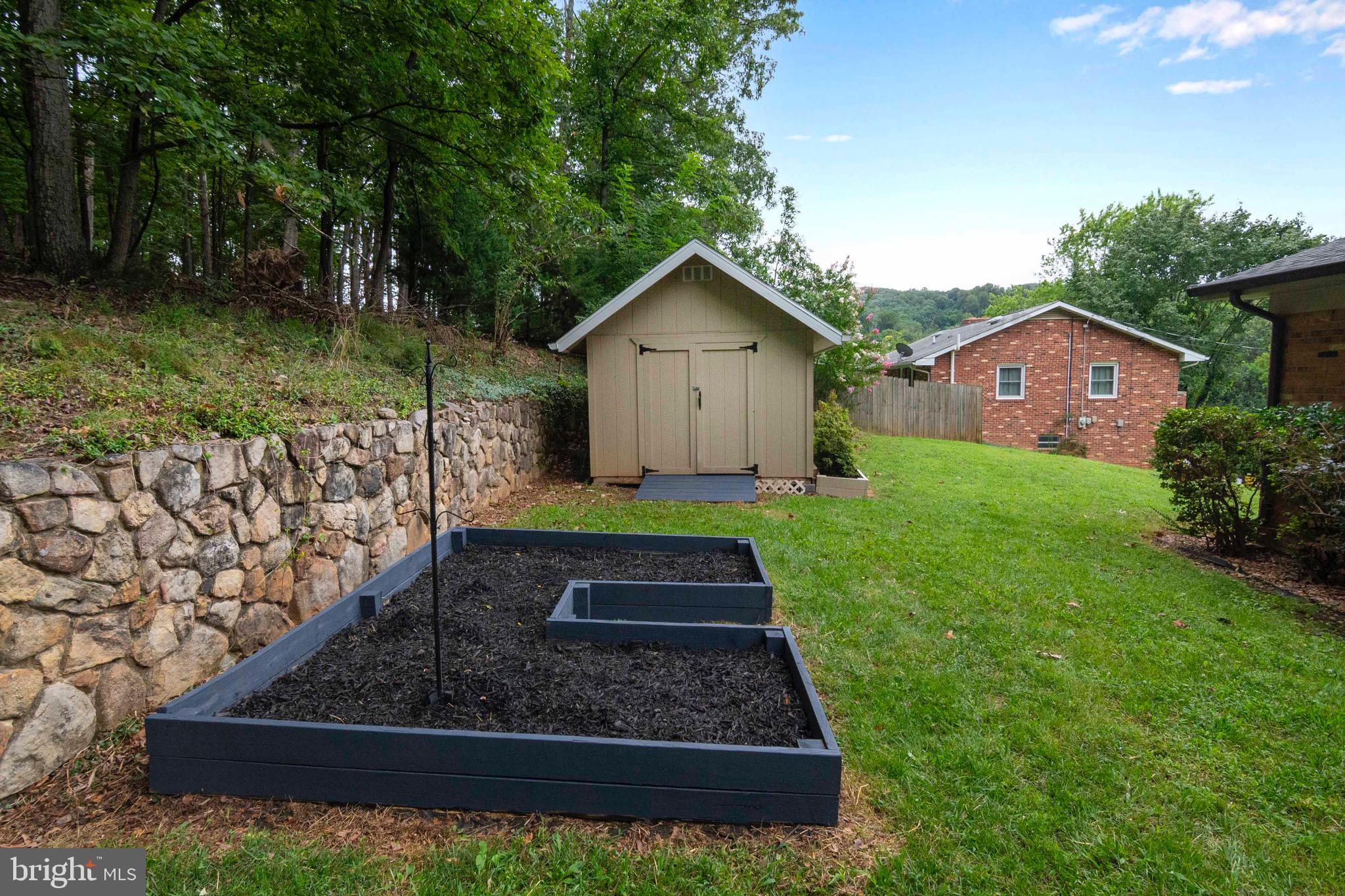 116 Richmond Road Front Royal, VA 22630 - Photo 50 of 60 Backyard with stone retaining wall.
