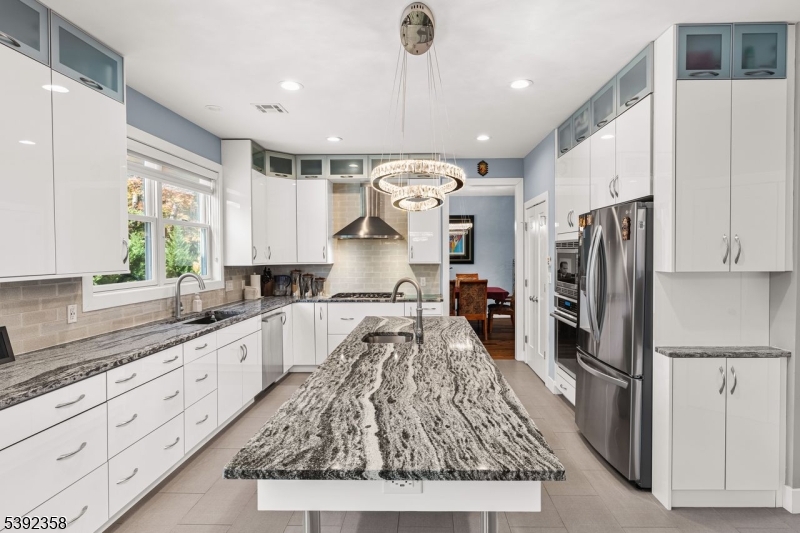 1993 Amwell Road Somerset, NJ 08873 - Photo 11 of 45 a large kitchen with granite countertop a refrigerator oven a sink and cabinets
