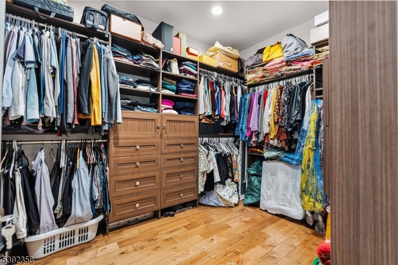 1993 Amwell Road Somerset, NJ 08873 - Photo 20 of 45 a view of walk in closet with clothes