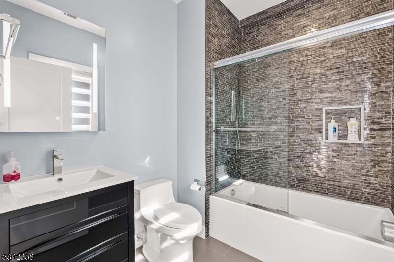 1993 Amwell Road Somerset, NJ 08873 - Photo 27 of 45 a bathroom with a sink a toilet and bathtub