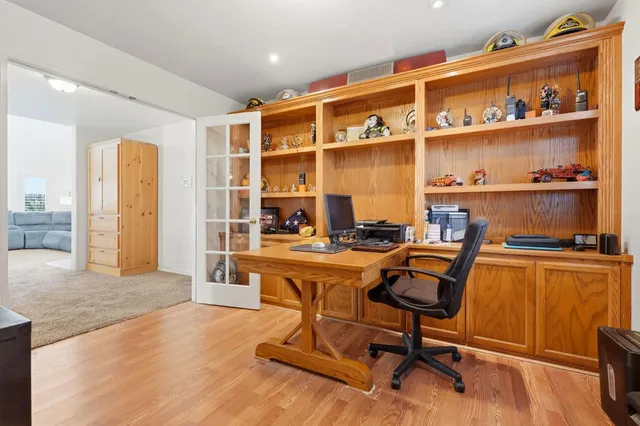a living room with furniture and kitchen view
