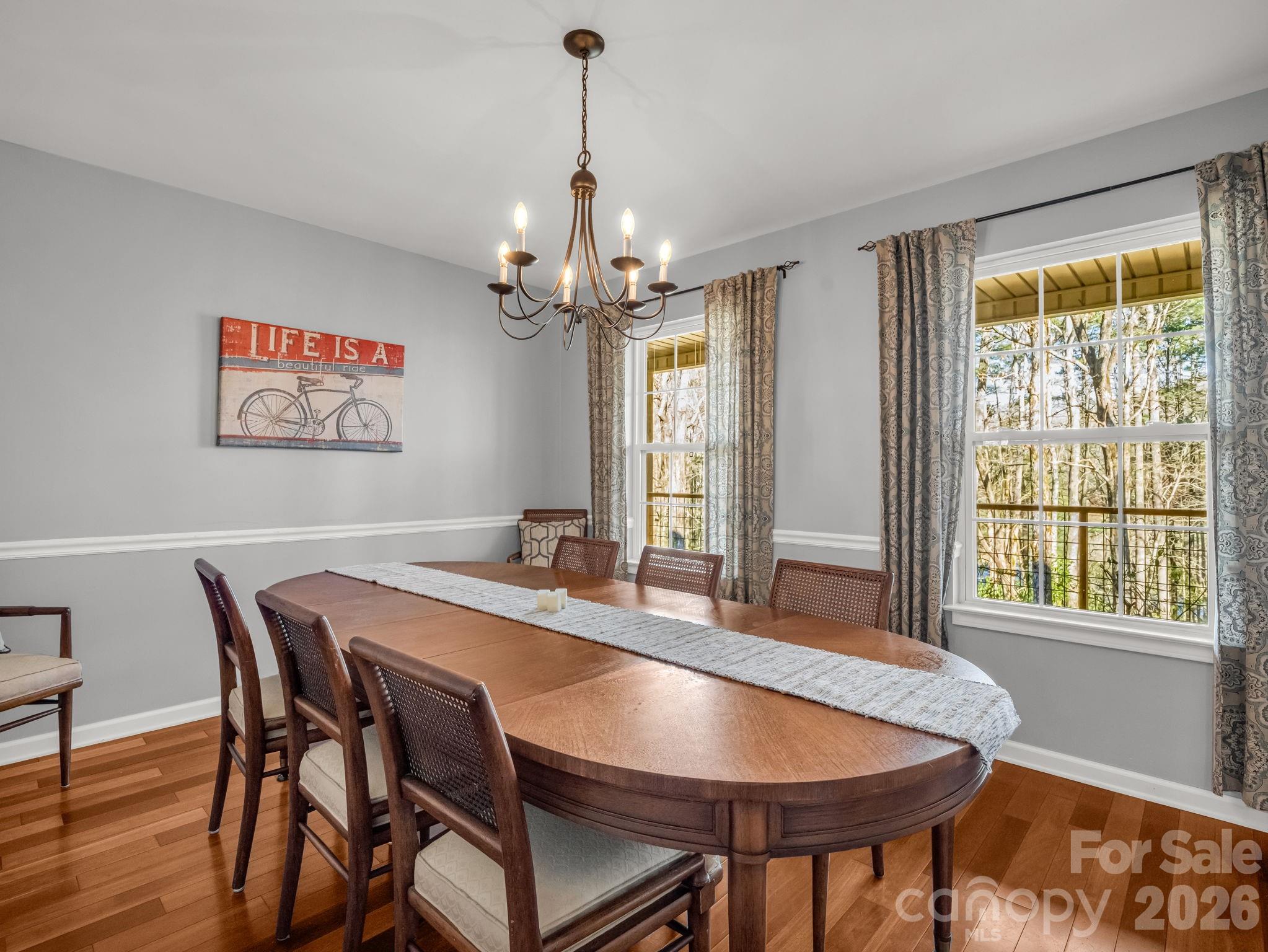 108 Nuthatch Trace Brevard, NC 28712 - Photo 15 of 46 a view of a dining room with furniture window and wooden floor