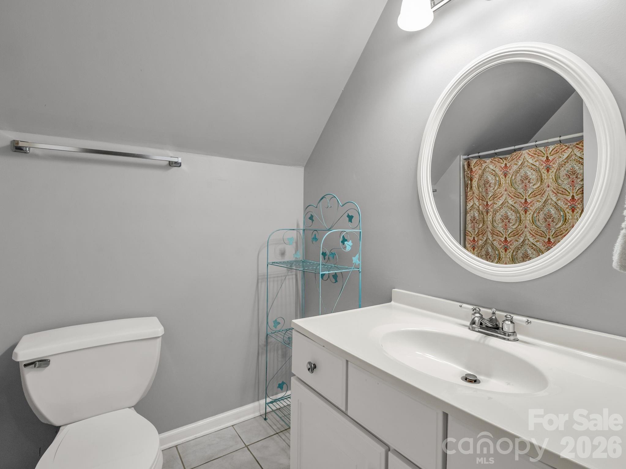 108 Nuthatch Trace Brevard, NC 28712 - Photo 20 of 46 a bathroom with a toilet sink and mirror