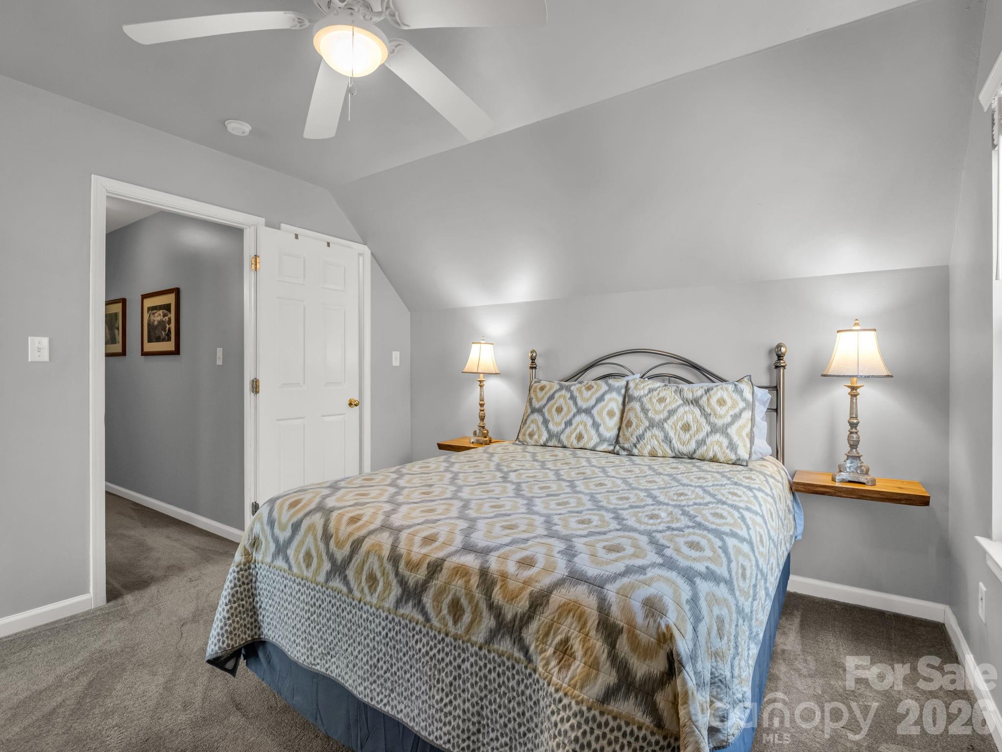 108 Nuthatch Trace Brevard, NC 28712 - Photo 23 of 46 a bedroom with a bed and a chandelier