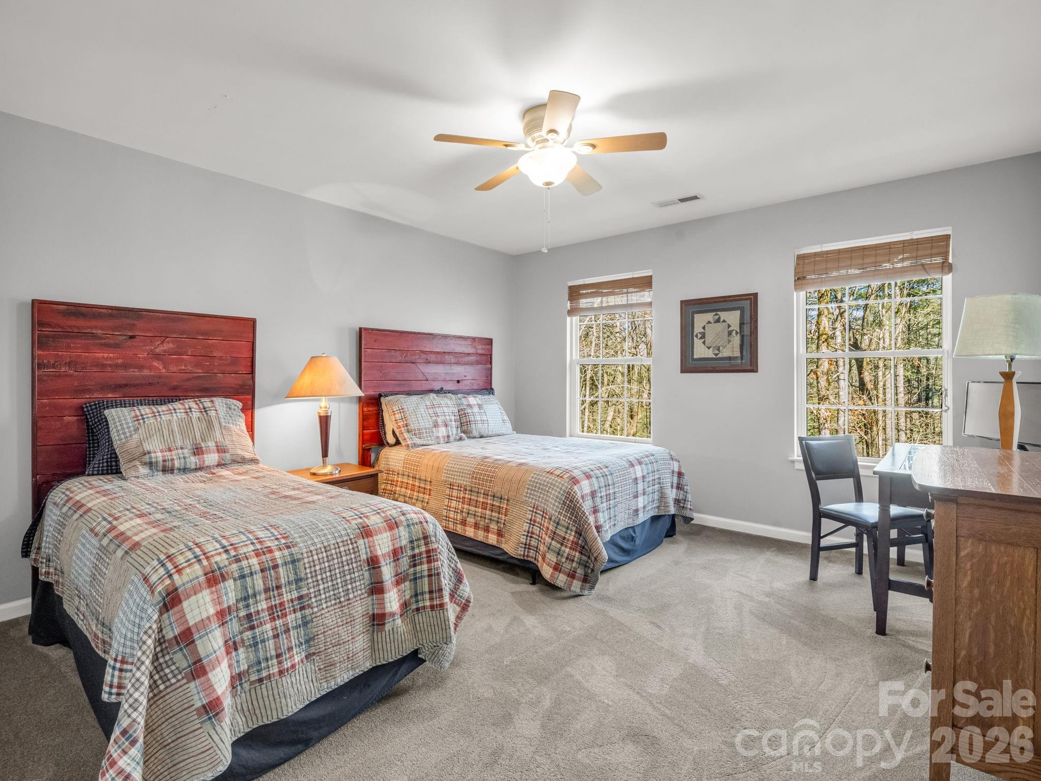 108 Nuthatch Trace Brevard, NC 28712 - Photo 25 of 46 a bedroom with two beds and a table