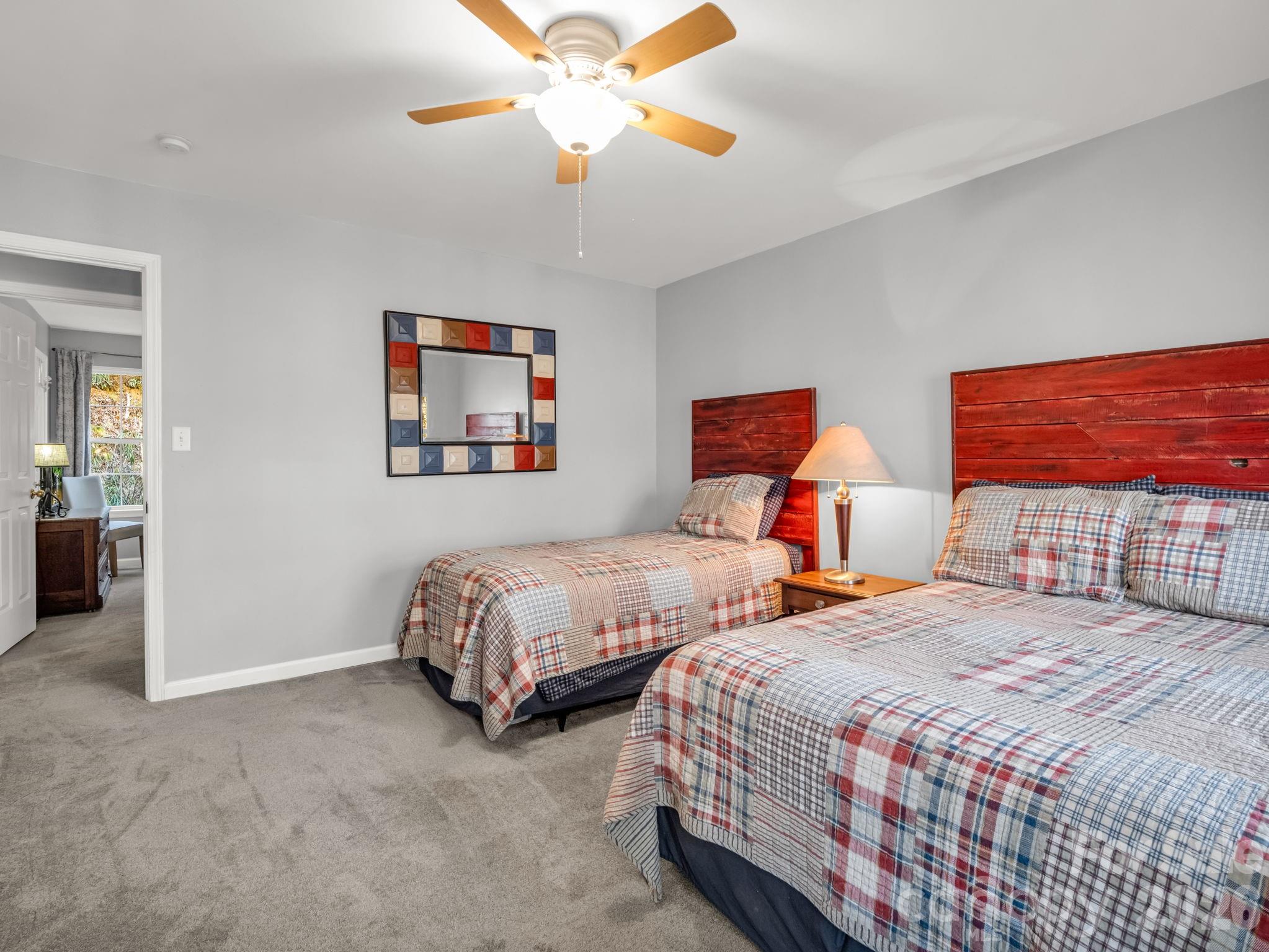 108 Nuthatch Trace Brevard, NC 28712 - Photo 27 of 46 a bedroom with two beds and a chandelier