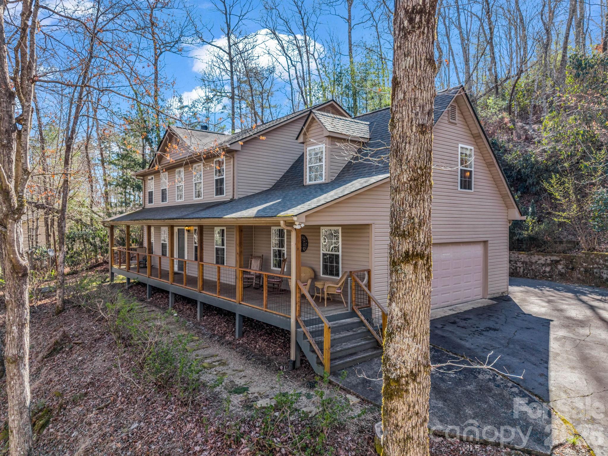108 Nuthatch Trace Brevard, NC 28712 - Photo 40 of 46 a view of a house with a yard and wooden fence