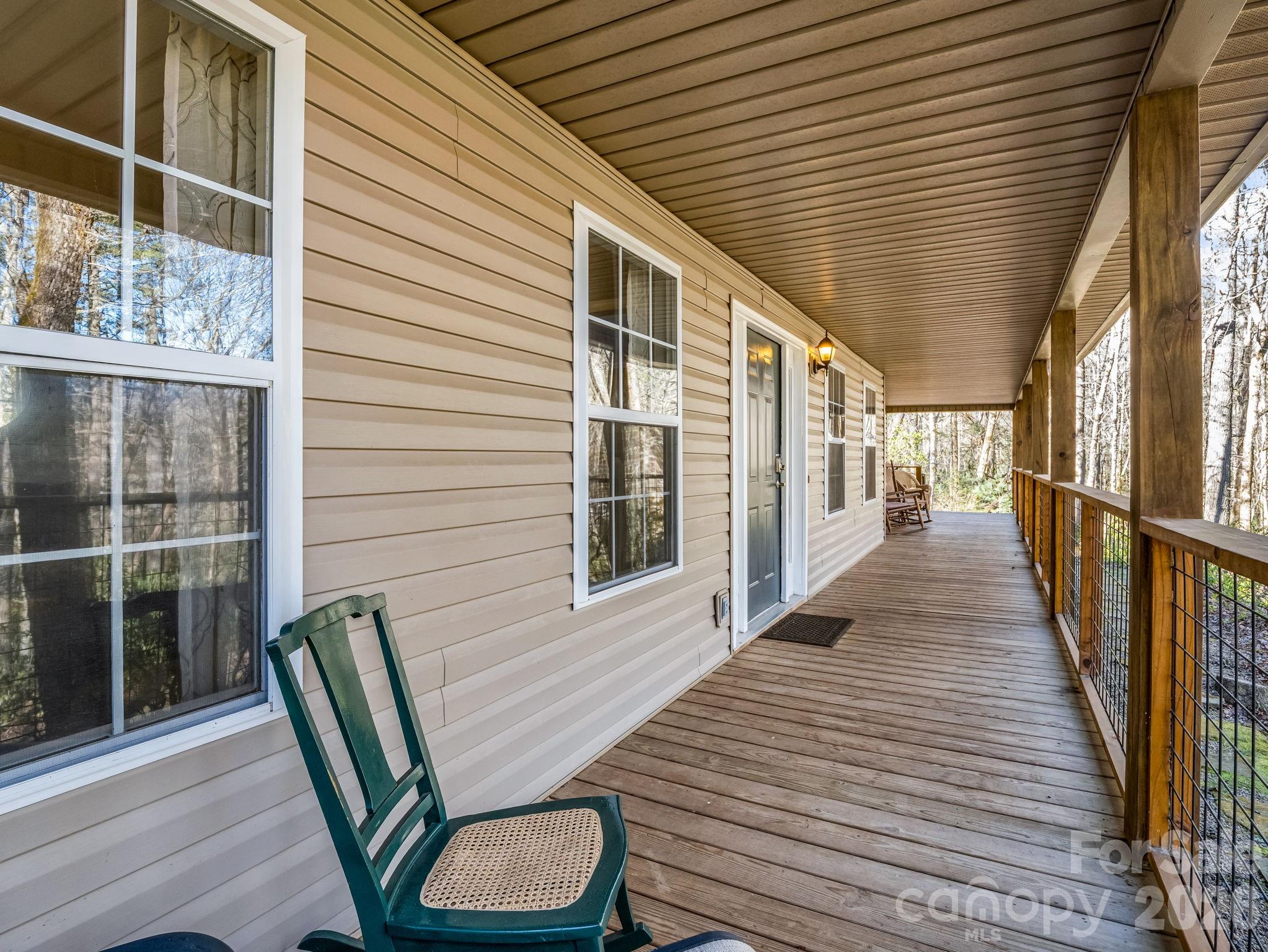108 Nuthatch Trace Brevard, NC 28712 - Photo 44 of 46 a balcony with wooden floor table and chairs