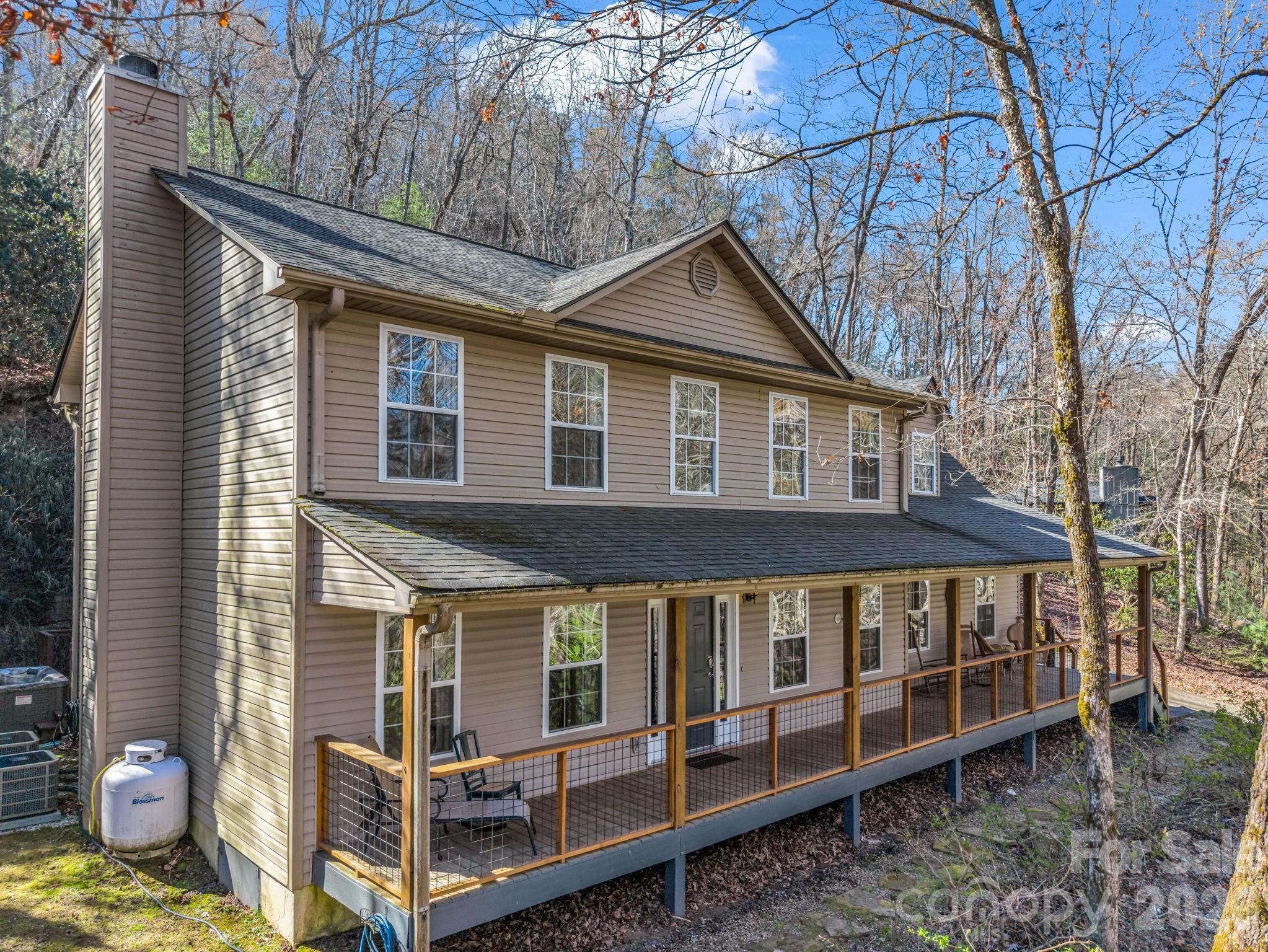 108 Nuthatch Trace Brevard, NC 28712 - Photo 45 of 46 a view of a house with a yard and wooden fence