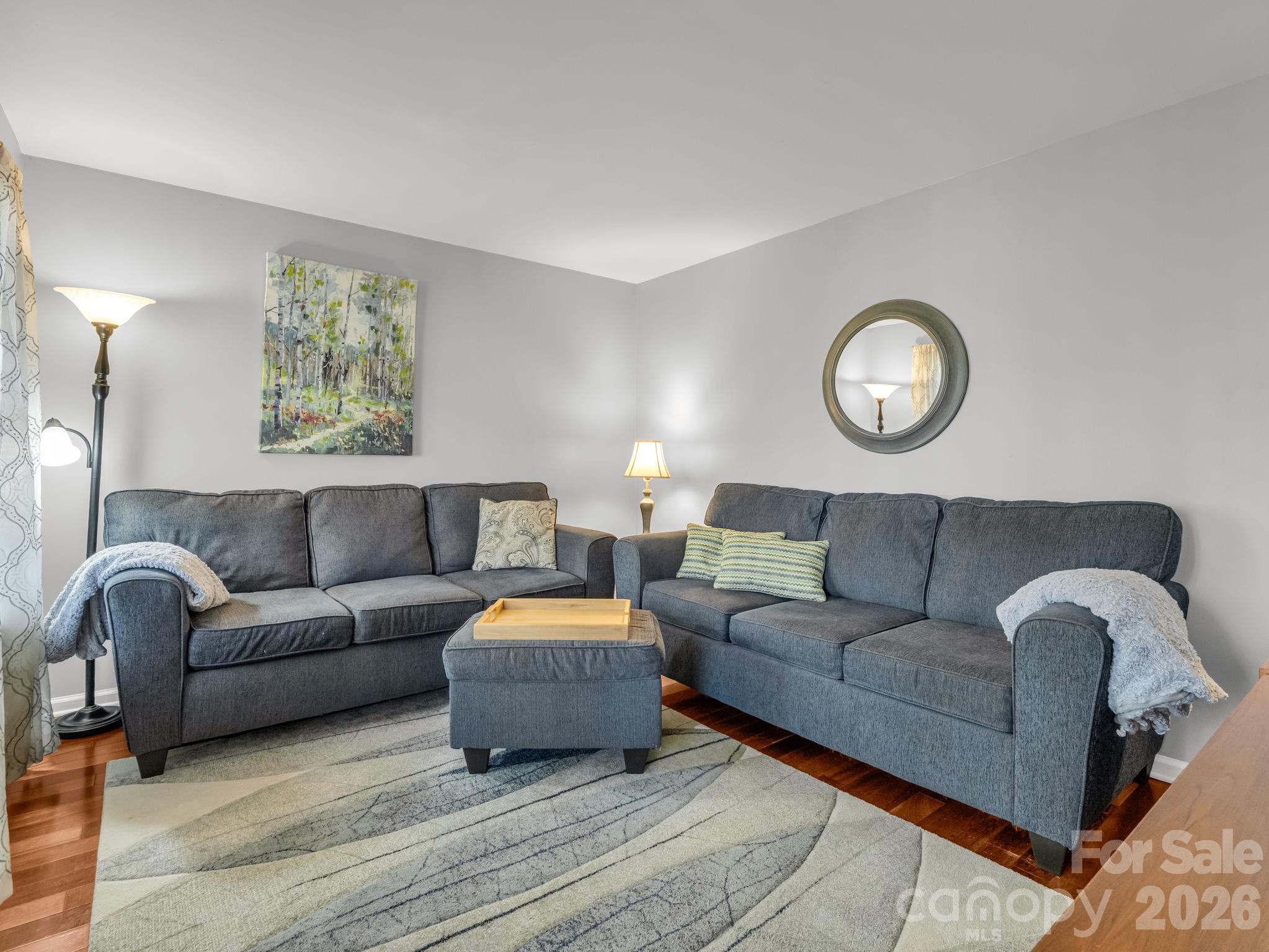 108 Nuthatch Trace Brevard, NC 28712 - Photo 6 of 46 a living room with furniture and a lamp