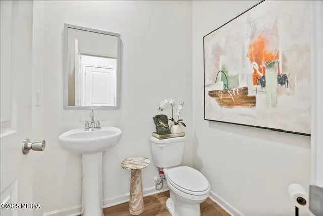 a view of small space with white walls and a window