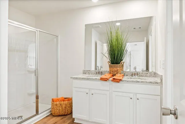a bathroom with a toilet and a shower curtain