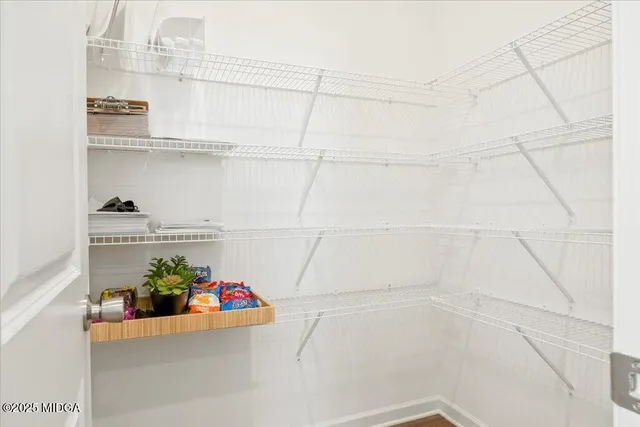 a kitchen with granite countertop a stove sink and microwave