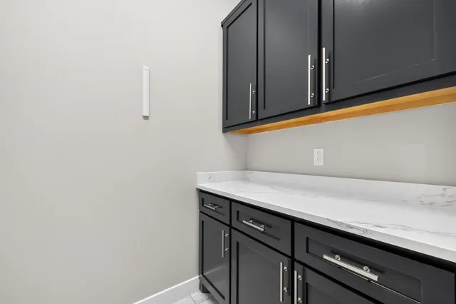 a close view of sink and cabinets