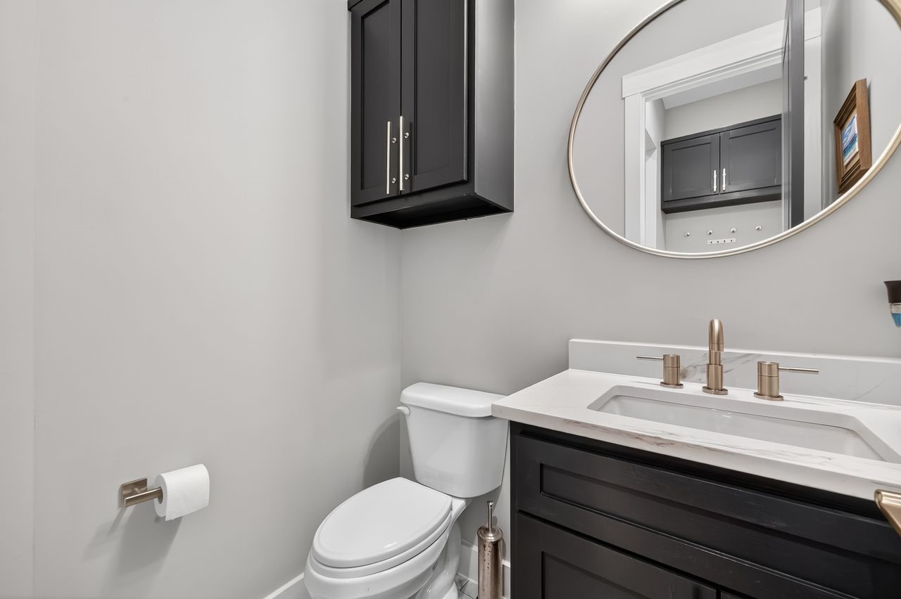 4508 Hardy Street, Unit B Houston, TX 77009 - Photo 17 of 40 a bathroom with a toilet a sink and mirror