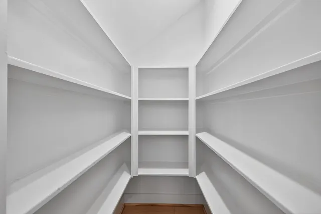 a view of an empty walk in closet