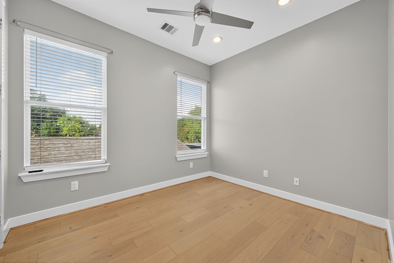 4508 Hardy Street, Unit B Houston, TX 77009 - Photo 19 of 40 an empty room with a window and ceiling fan