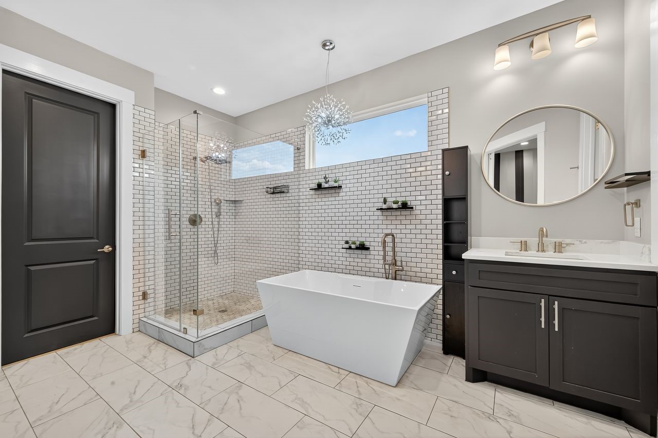 4508 Hardy Street, Unit B Houston, TX 77009 - Photo 30 of 40 a spacious bathroom with a bathtub shower sink mirror and toilet