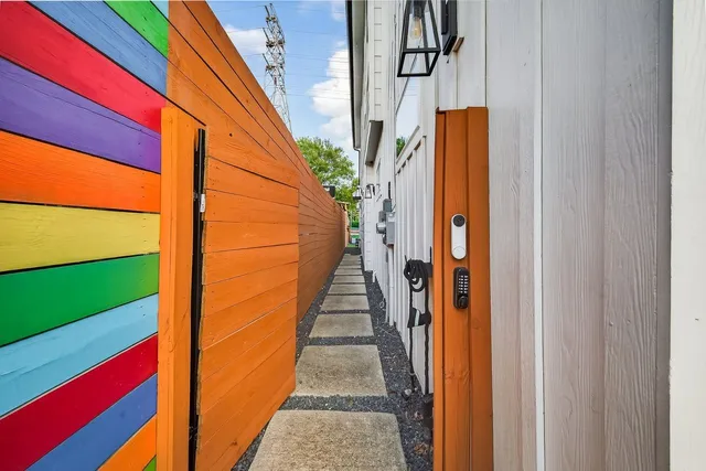 a view of a house with a backyard and a patio