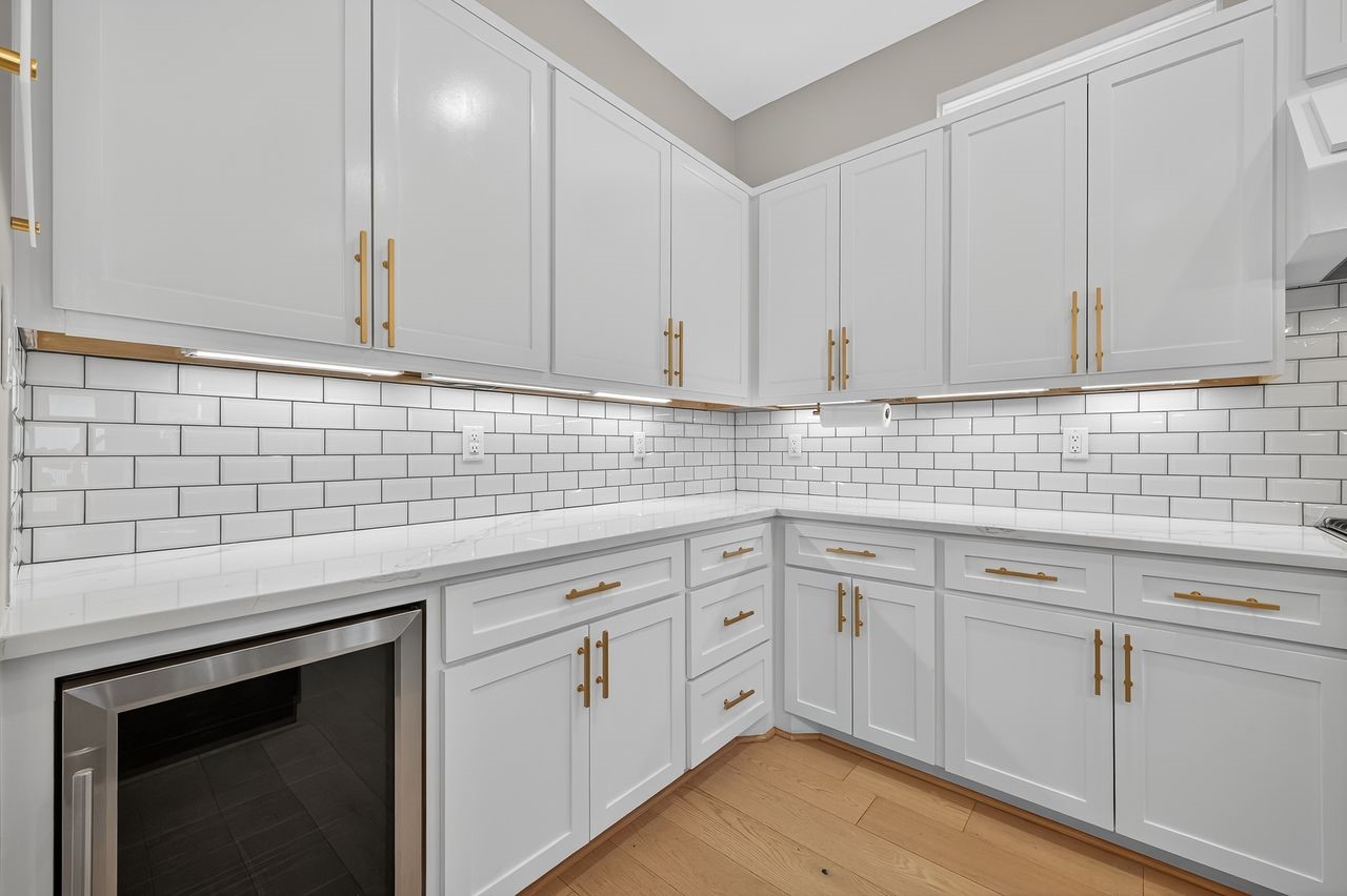 4508 Hardy Street, Unit B Houston, TX 77009 - Photo 10 of 40 a kitchen with white cabinets a sink and dishwasher