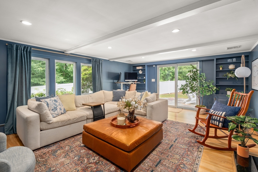 57 Marlboro Road Sudbury, MA 01776 - Photo 12 of 40 a living room with furniture and large windows