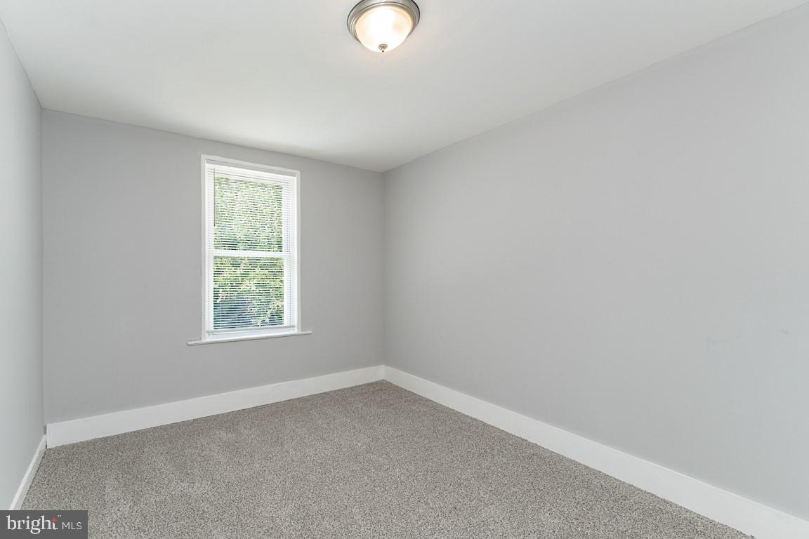 3006 Mathews Street Baltimore, MD 21218 - Photo 15 of 25 an empty room with a window