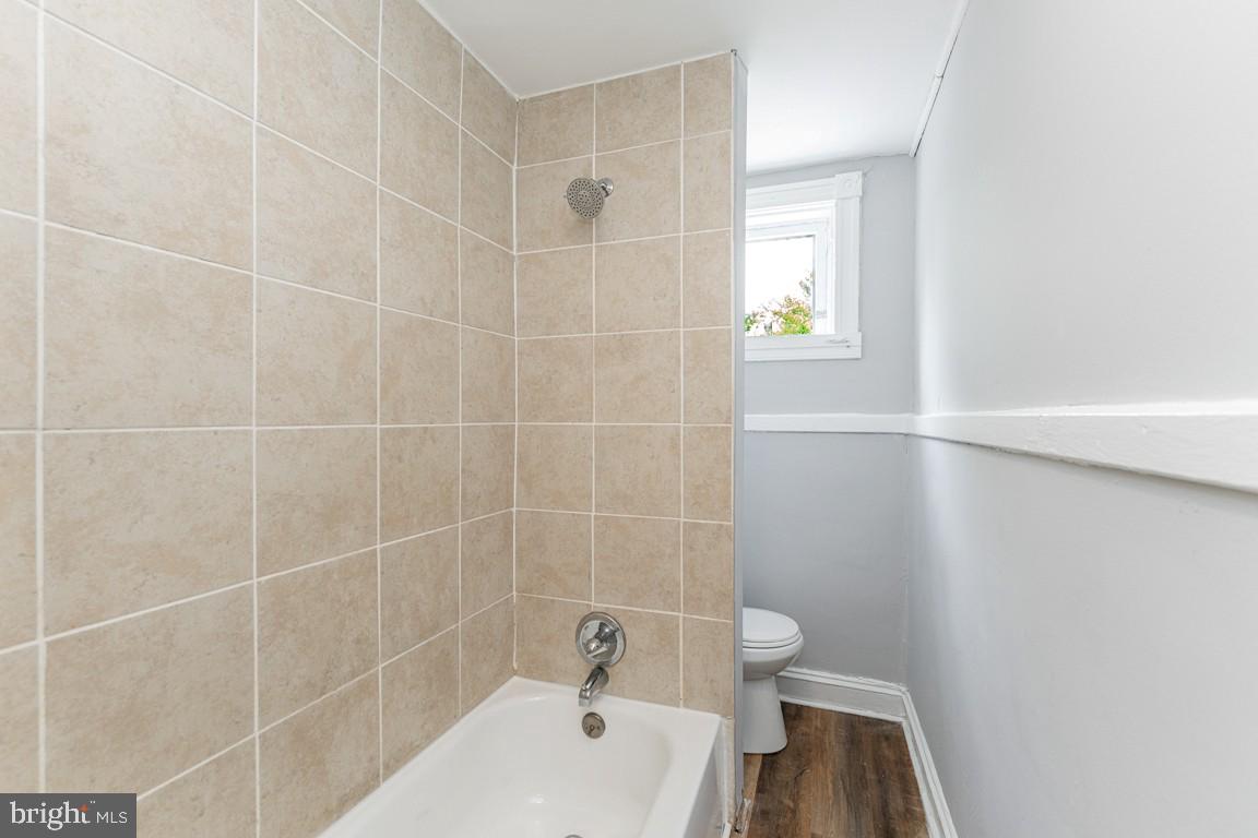 3006 Mathews Street Baltimore, MD 21218 - Photo 16 of 25 a bathroom with a bathtub and a sink