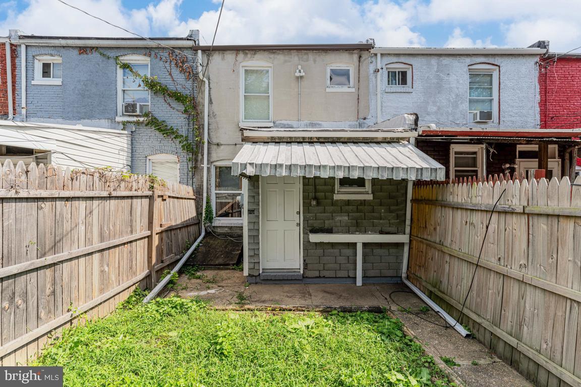 3006 Mathews Street Baltimore, MD 21218 - Photo 22 of 25 a view of a house with wooden deck and furniture