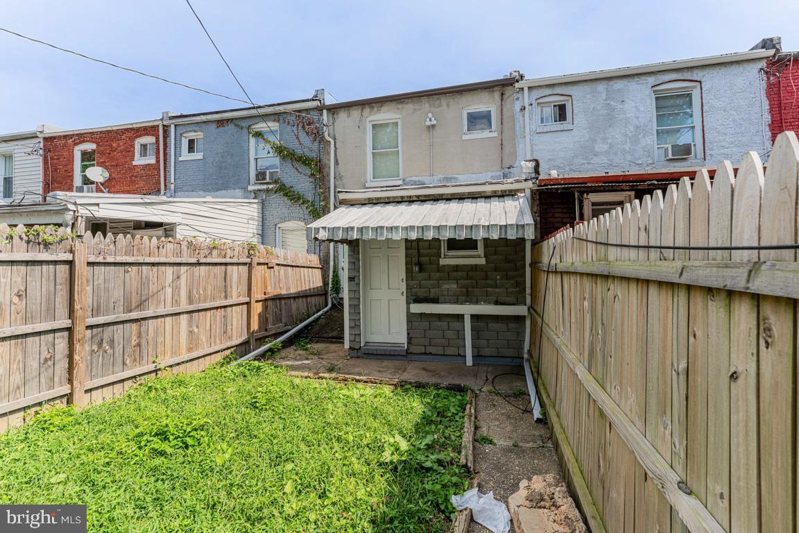 3006 Mathews Street Baltimore, MD 21218 - Photo 23 of 25 a view of a house with wooden fence