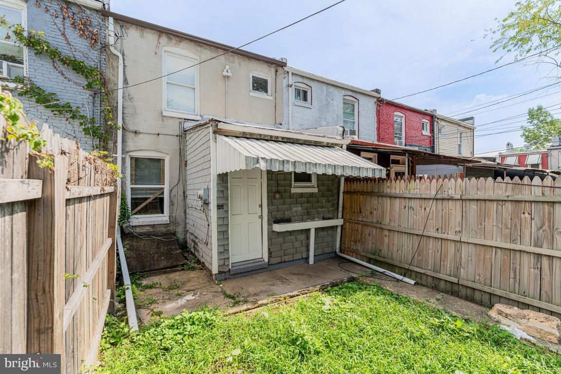 3006 Mathews Street Baltimore, MD 21218 - Photo 24 of 25 a view of a house with a wooden fence