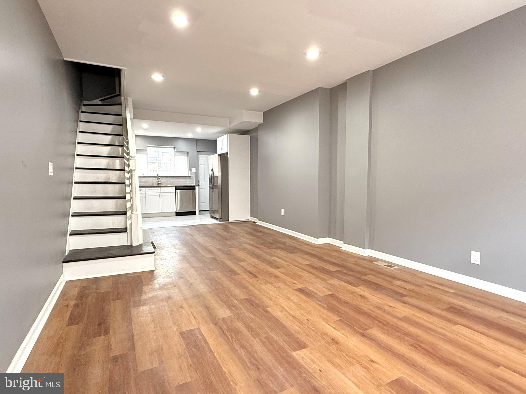 1114 Mercy Street Philadelphia, PA 19148 - Photo 3 of 35 a view of an empty room with stairs and a window