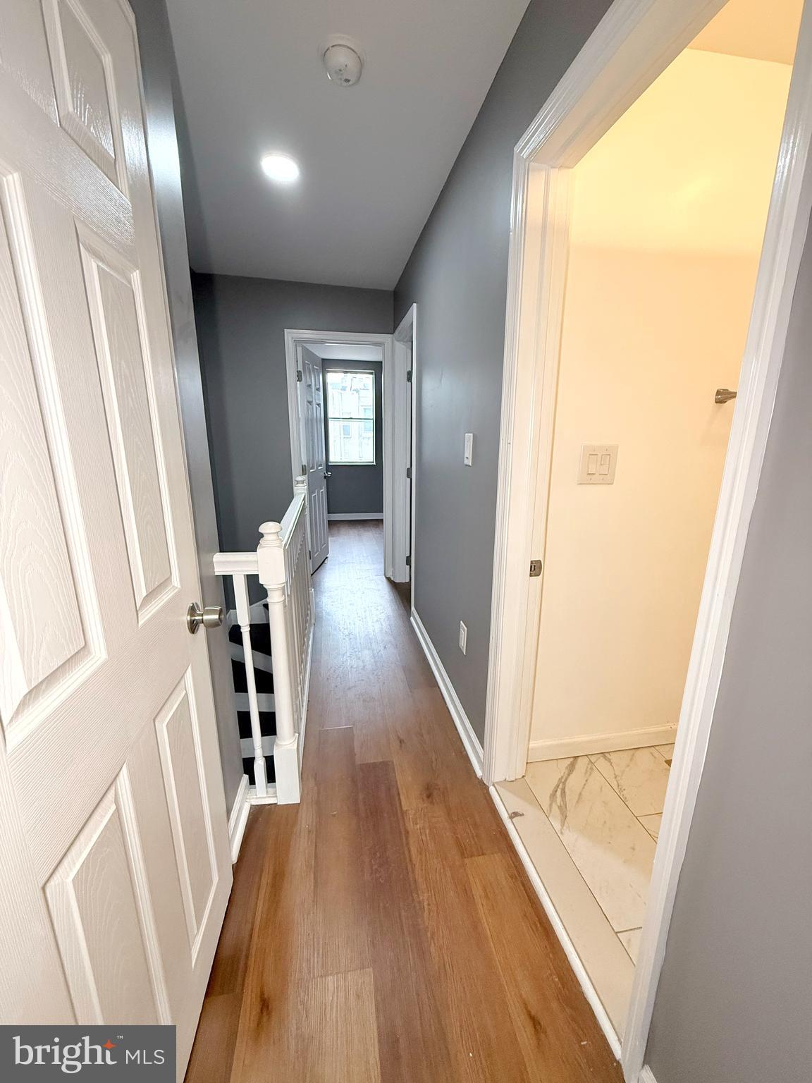 1114 Mercy Street Philadelphia, PA 19148 - Photo 31 of 35 a view of a hallway with wooden floor and stairs