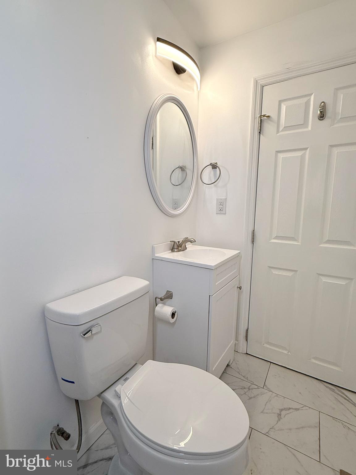 1114 Mercy Street Philadelphia, PA 19148 - Photo 33 of 35 a white toilet sitting next to a bathroom sink
