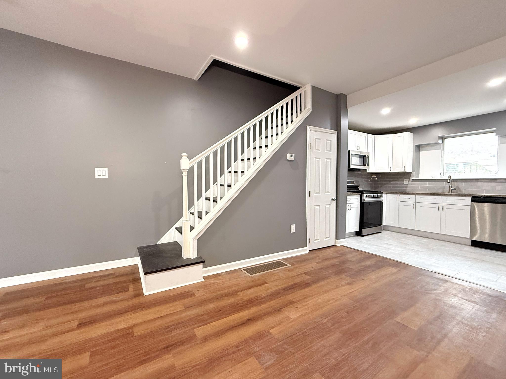 1114 Mercy Street Philadelphia, PA 19148 - Photo 5 of 35 a view of a kitchen with a sink and cabinets