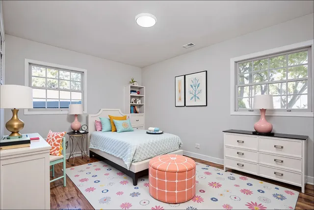 a bedroom with furniture and a window