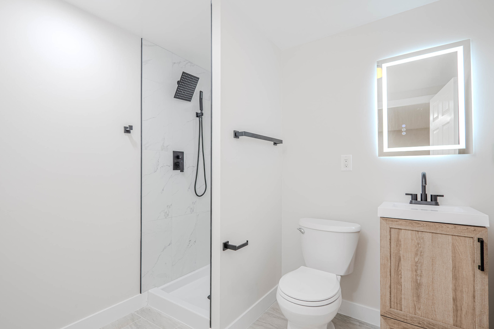 839 North Bennett Street Geneva, IL 60134 - Photo 20 of 33 a bathroom with a sink a toilet and shower
