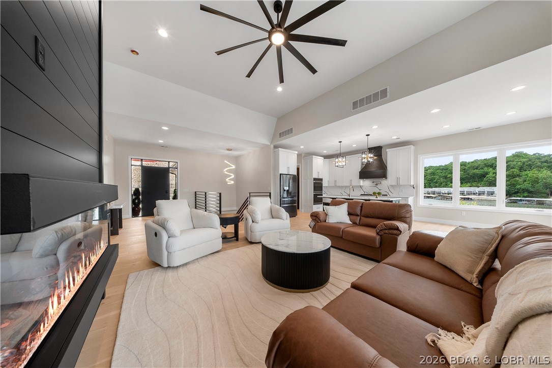 439 Red Bud Road Lake Ozark, MO 65049 - Photo 12 of 98 Open-concept great room designed for effortless en